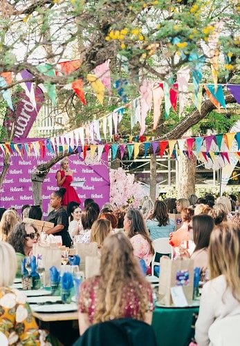 Corporate garden function beneath bunting