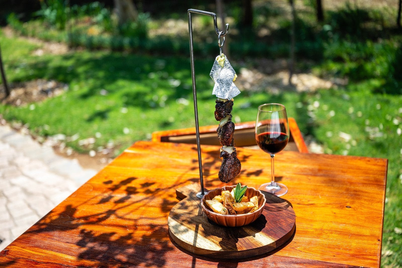 Picanha espetada grilled over open fire at Droombos Estate