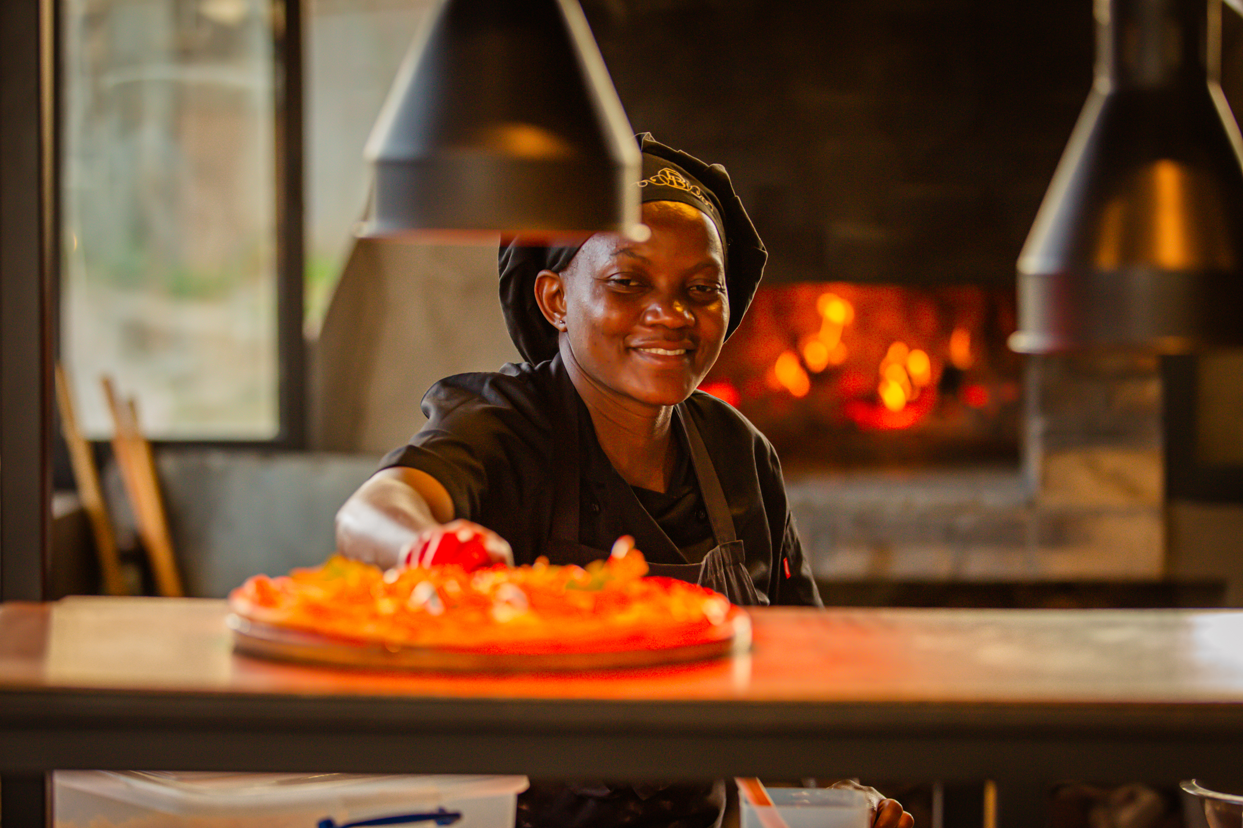 Pizza chef at the Birdcage Restaurant wood fired oven