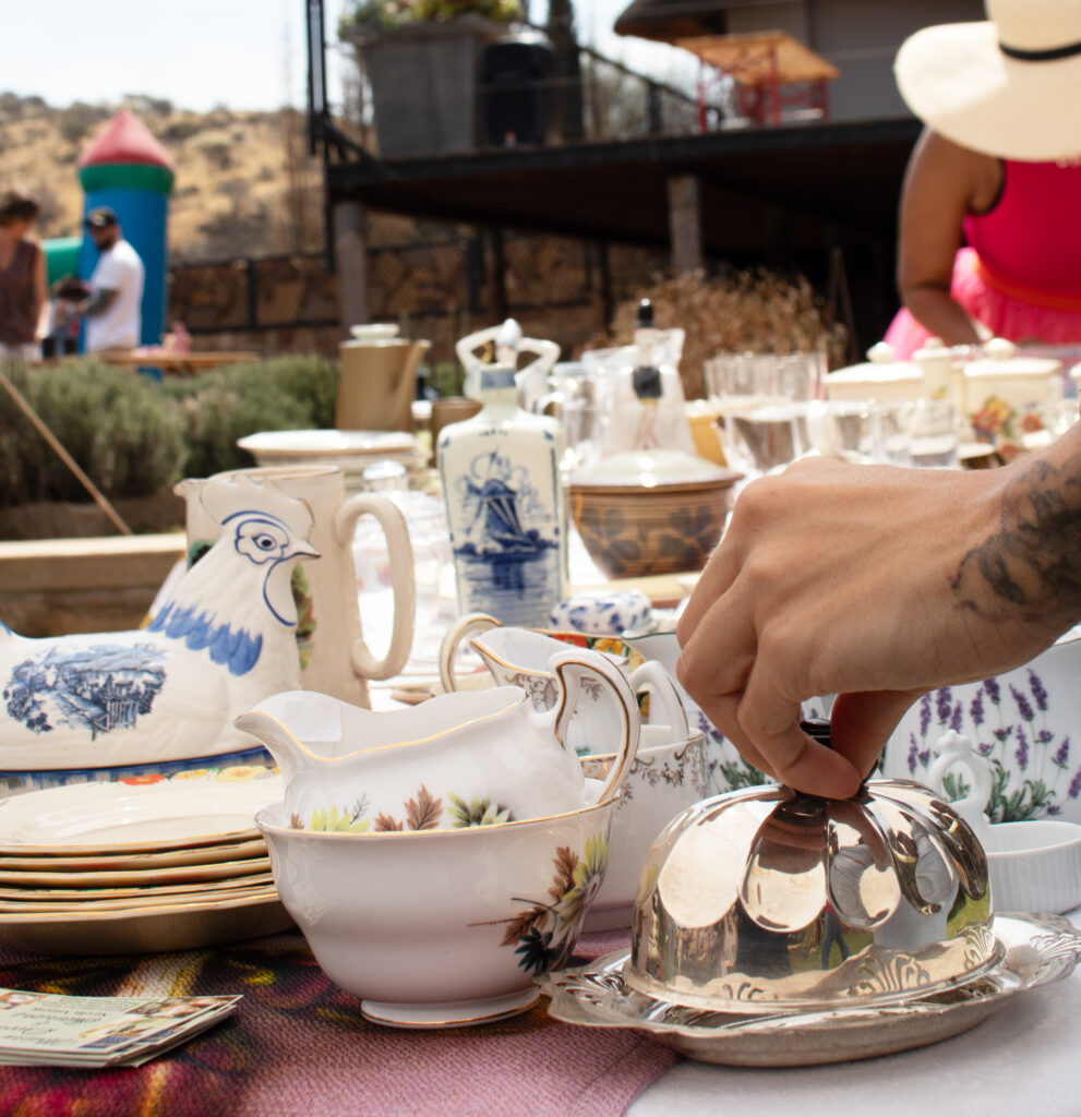 Vintage china, jugs and silverware on a stall at a previous Droombos market